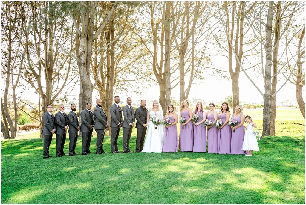bridal party with purple dresses