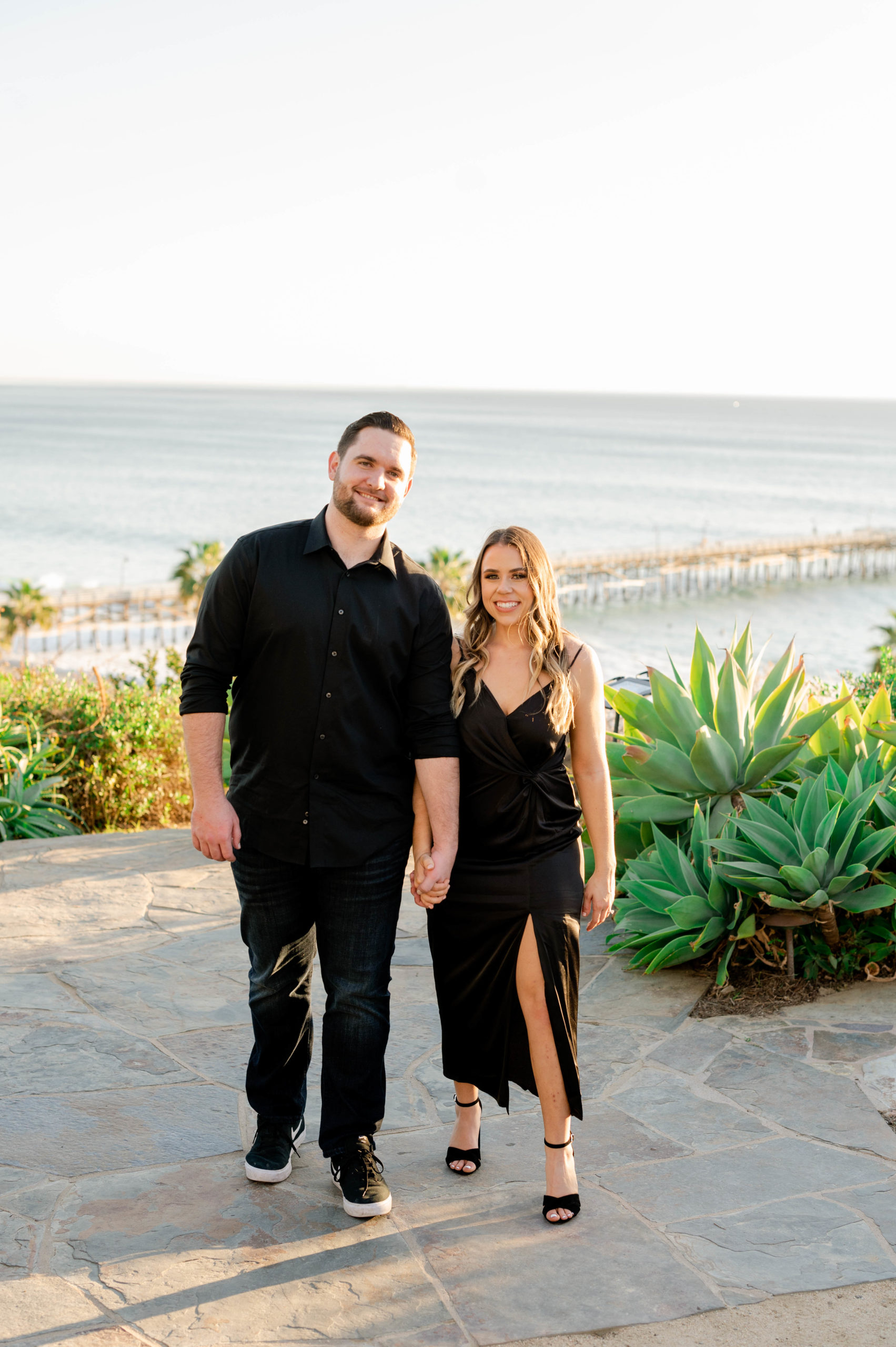 Classic couple wearing black for their engagement photos